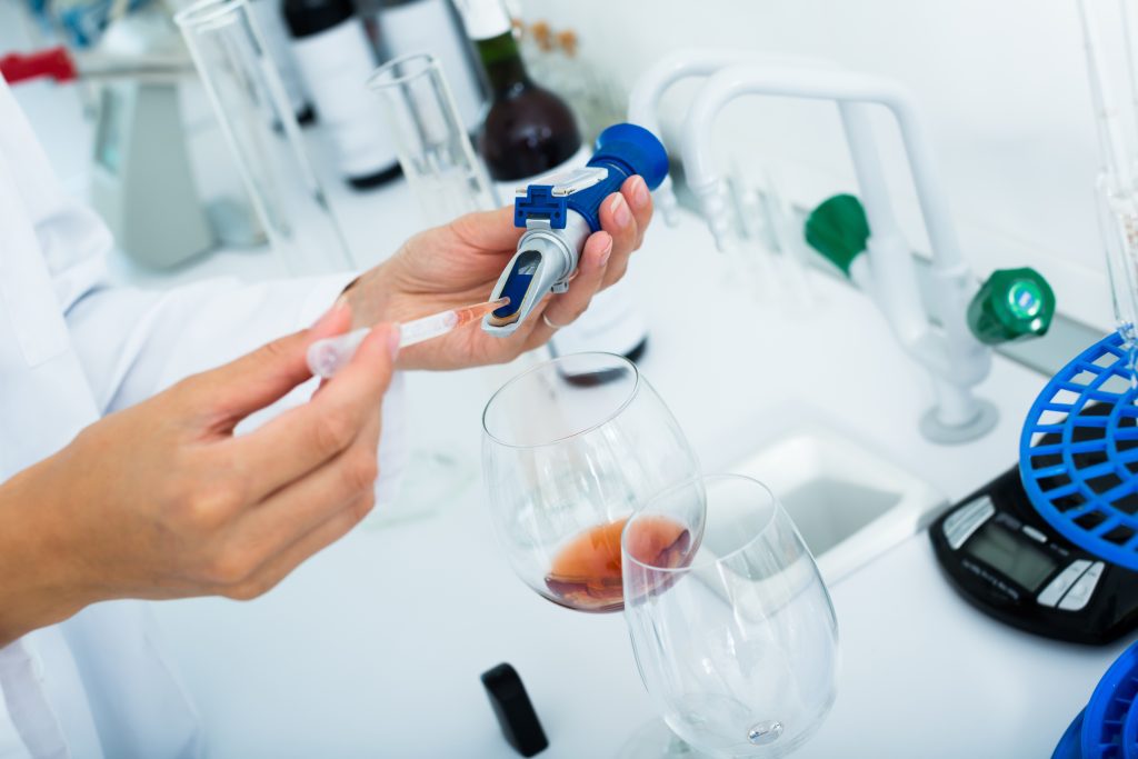 scientist pipetted wine 