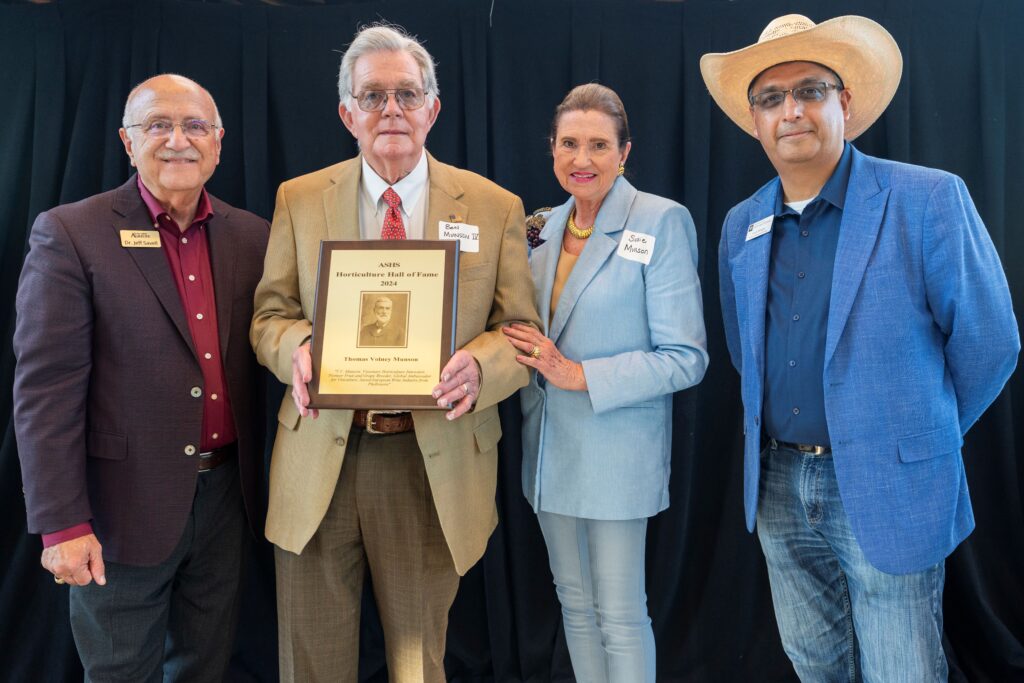 L to R: Dr. Jeffrey Savell, Vice Chancellor and Dean, College of Agriculture and Life Sciences, Mr. WB Bunson, Ms Susie Munson – TV Munson family members, Dr. Amit Dhingra, Profession and Head, Department of Horticultural Sciences with the ASHS Hall of Fame Plaque