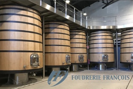it shows 4 very large wine tanks with wooden exteriors