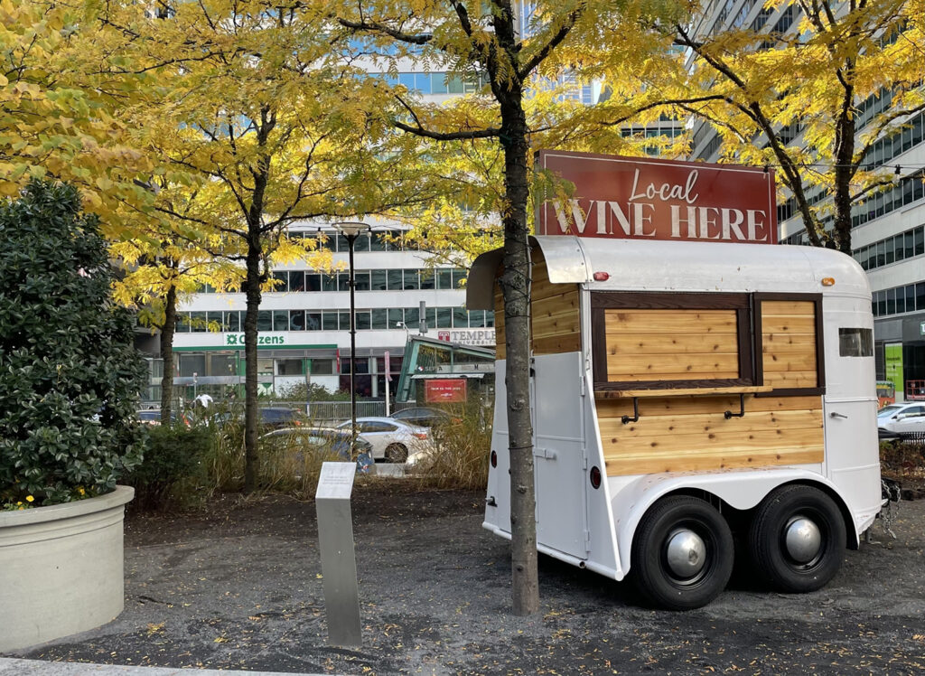 mobile trailer with sign saying local wine here